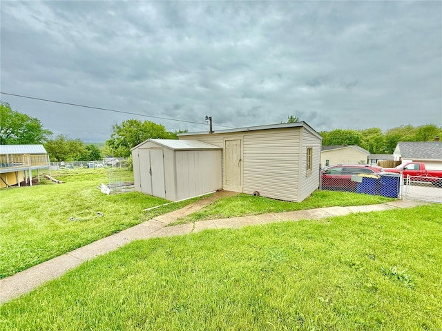 view of shed with fence