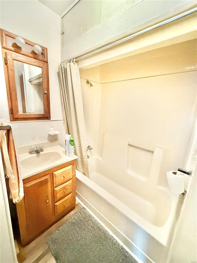 bathroom with vanity and shower / bath combo with shower curtain