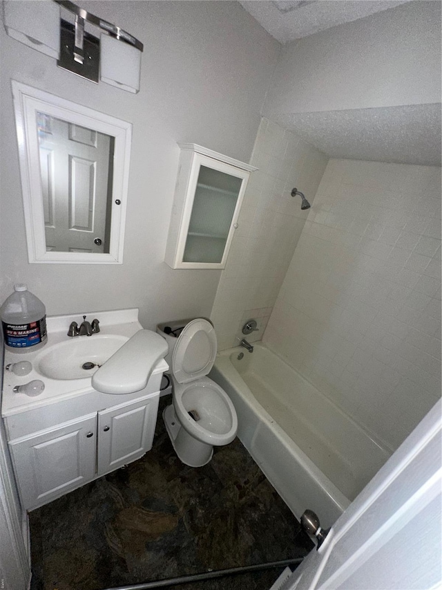 bathroom featuring vanity, toilet, and shower / washtub combination