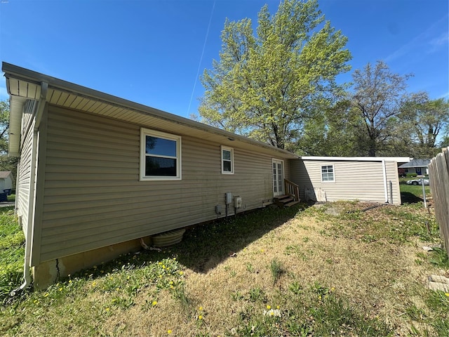rear view of property with entry steps