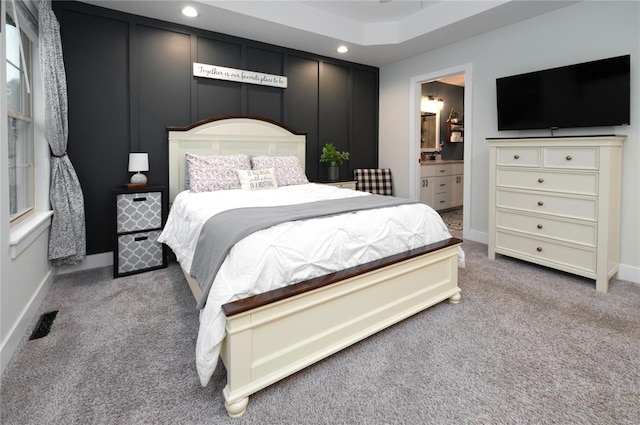 bedroom featuring visible vents, baseboards, ensuite bathroom, carpet, and recessed lighting