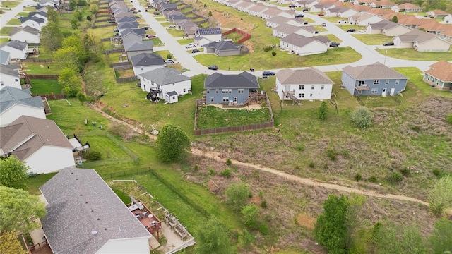 birds eye view of property with a residential view