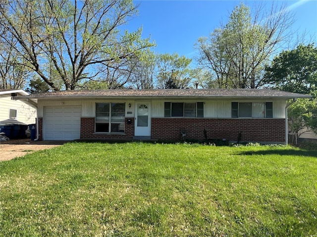 ranch-style house with brick siding, an attached garage, and a front yard