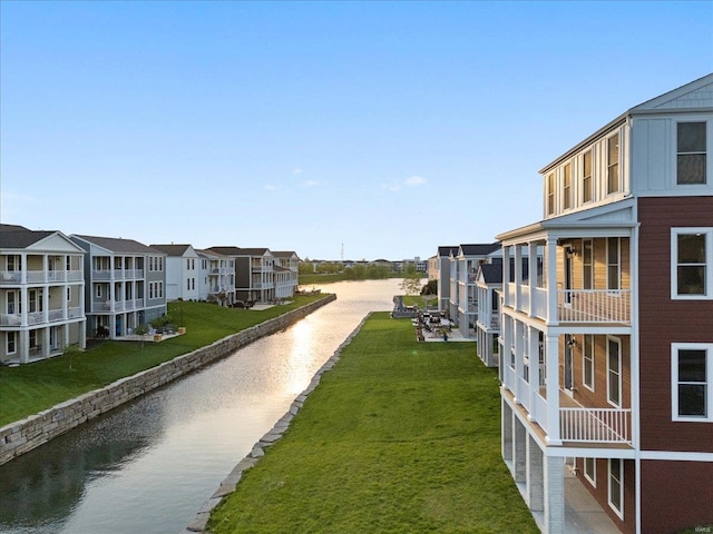 view of home's community featuring a water view and a residential view
