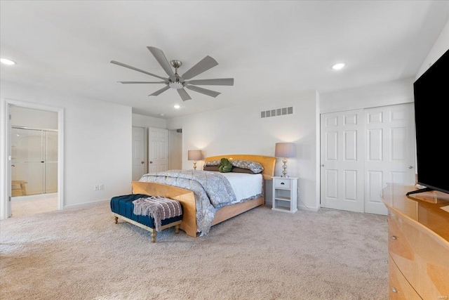 carpeted bedroom with ceiling fan, ensuite bathroom, recessed lighting, and visible vents