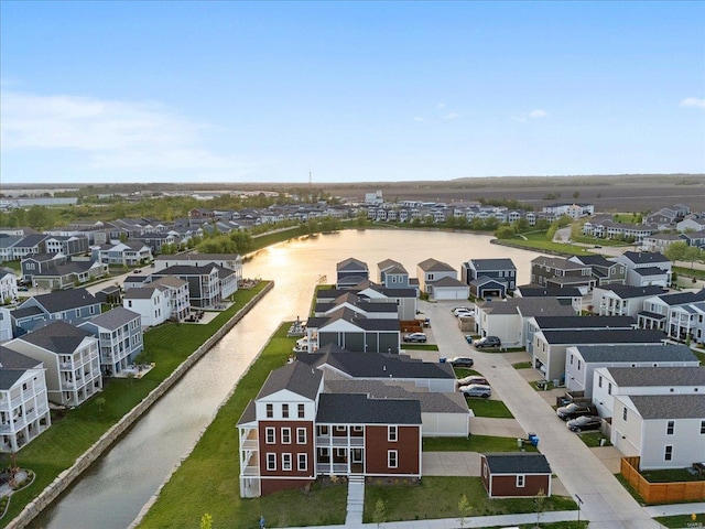 birds eye view of property featuring a residential view and a water view