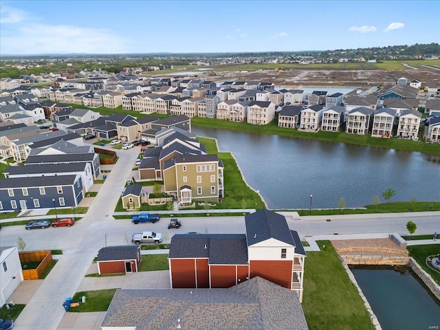 aerial view featuring a water view and a residential view