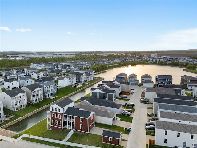 bird's eye view featuring a residential view and a water view