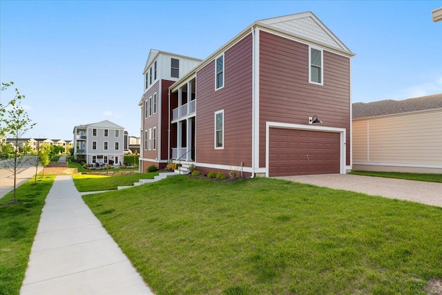 view of front of house with an attached garage, concrete driveway, and a front yard