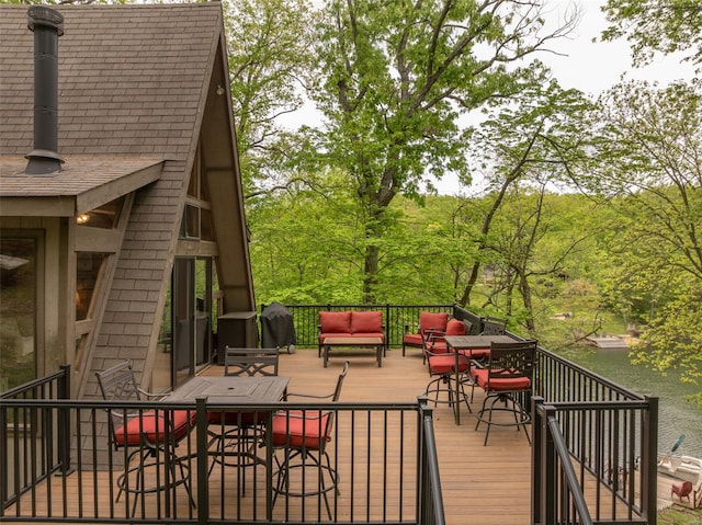 wooden deck featuring outdoor lounge area and outdoor dining space