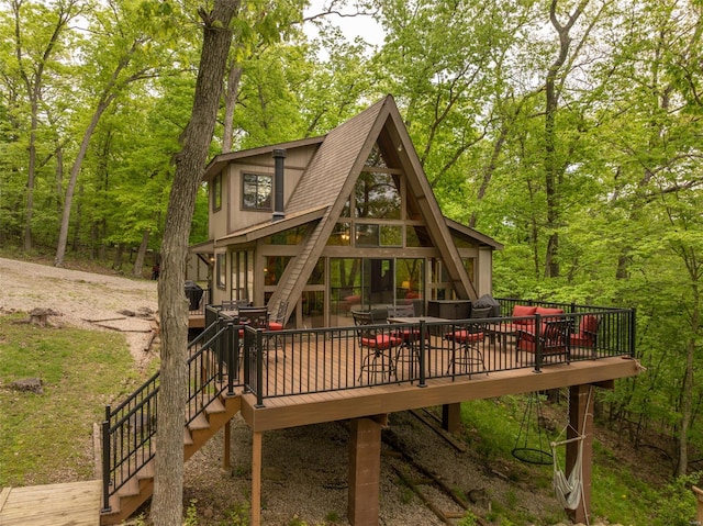 exterior space with stairs and a view of trees