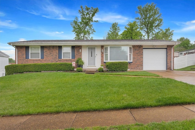 ranch-style house with a garage, concrete driveway, a front yard, and brick siding