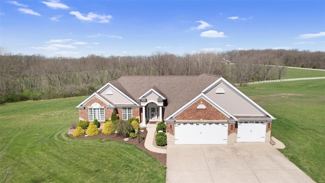 view of front of house with a garage, a front lawn, brick siding, and driveway