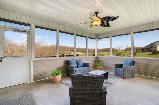 sunroom featuring ceiling fan and an outdoor hangout area