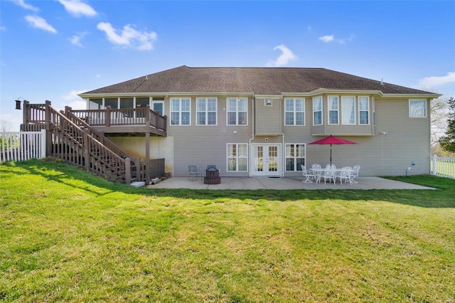 back of property with french doors, fence, a patio area, a deck, and stairway