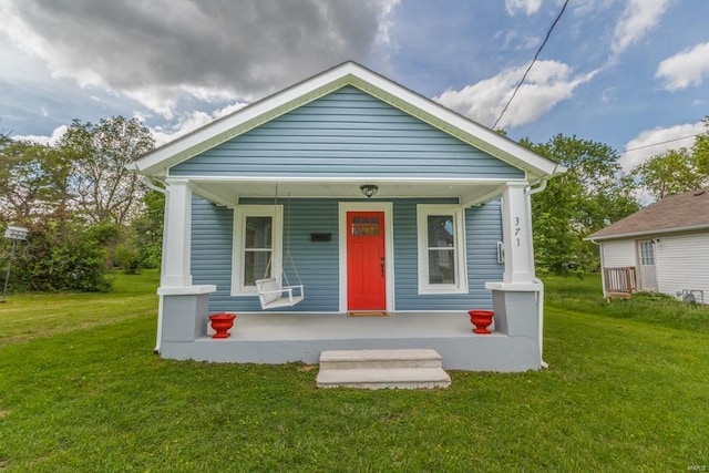 view of front of home featuring a porch and a front lawn