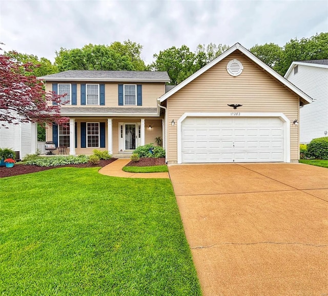 view of front of home featuring concrete driveway, an attached garage, covered porch, and a front lawn
