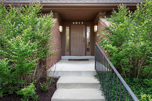 property entrance with brick siding