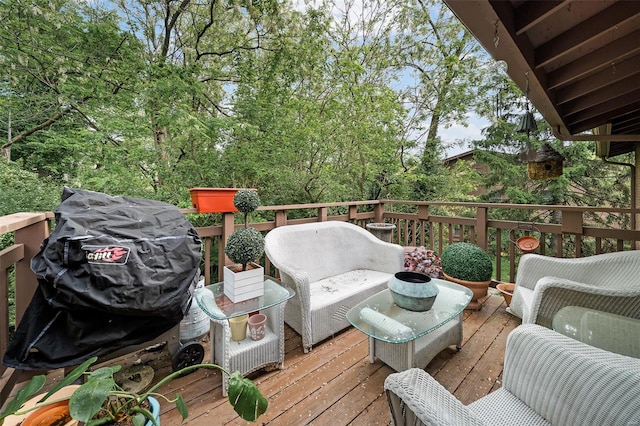 wooden deck with a grill