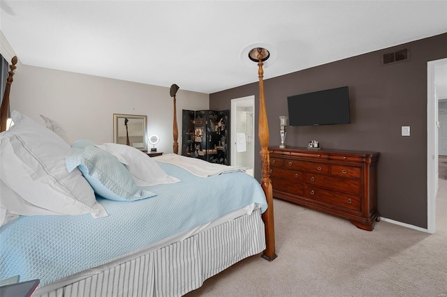 bedroom with carpet floors, baseboards, connected bathroom, and visible vents