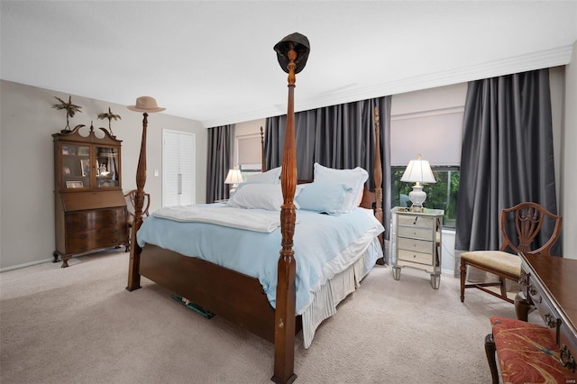carpeted bedroom featuring baseboards