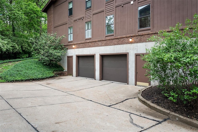 garage with concrete driveway