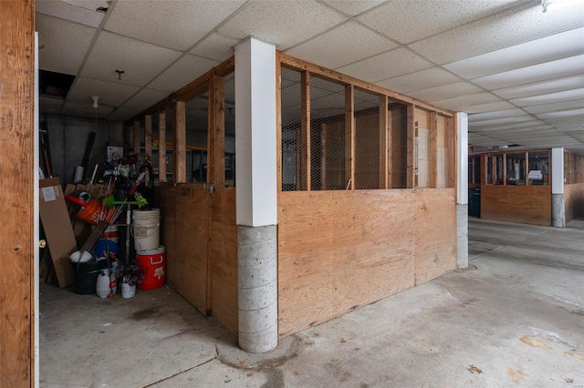 basement featuring a paneled ceiling