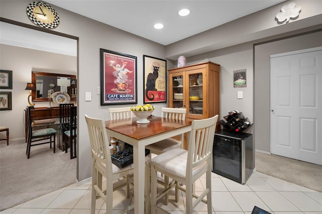 dining room featuring light colored carpet, recessed lighting, baseboards, and light tile patterned flooring