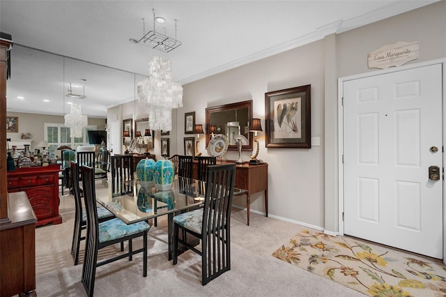 dining room with carpet flooring, crown molding, a chandelier, and baseboards