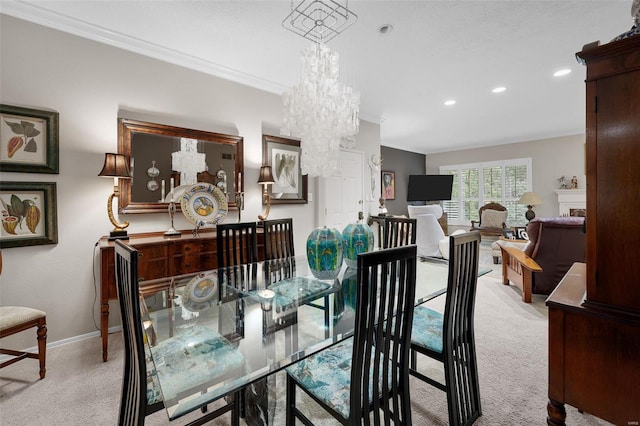 carpeted dining area with recessed lighting, baseboards, a notable chandelier, and ornamental molding