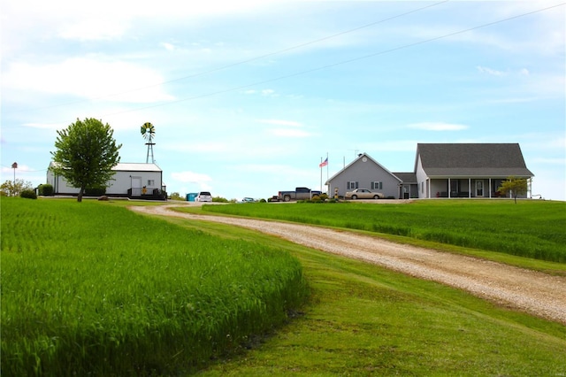 view of road with gravel driveway