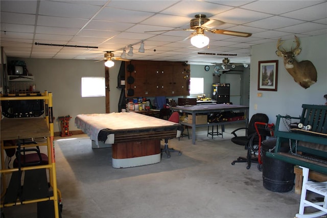 recreation room featuring billiards, ceiling fan, a drop ceiling, and concrete flooring