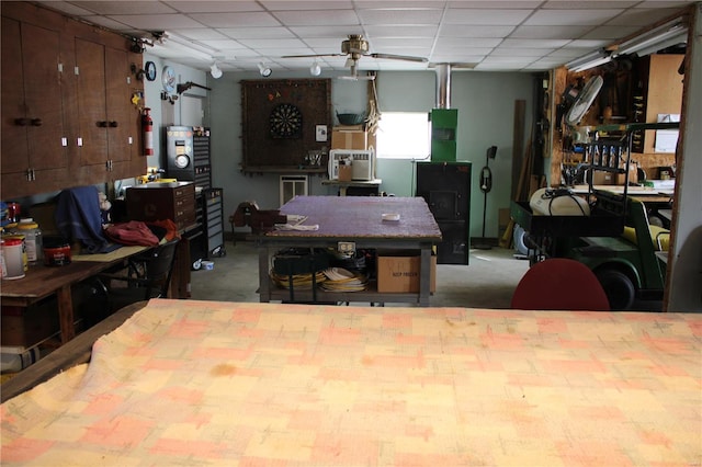 interior space featuring a drop ceiling and a workshop area