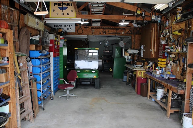 garage with a workshop area