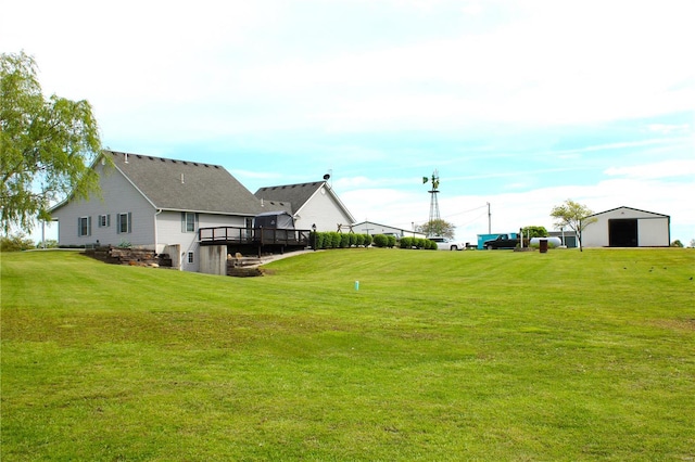 view of yard featuring an outbuilding and a deck