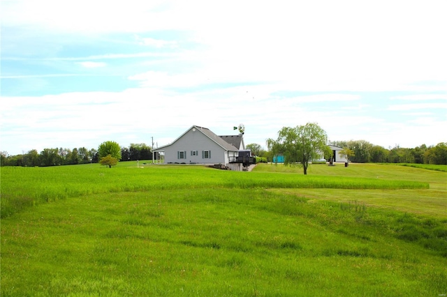 view of yard with a rural view