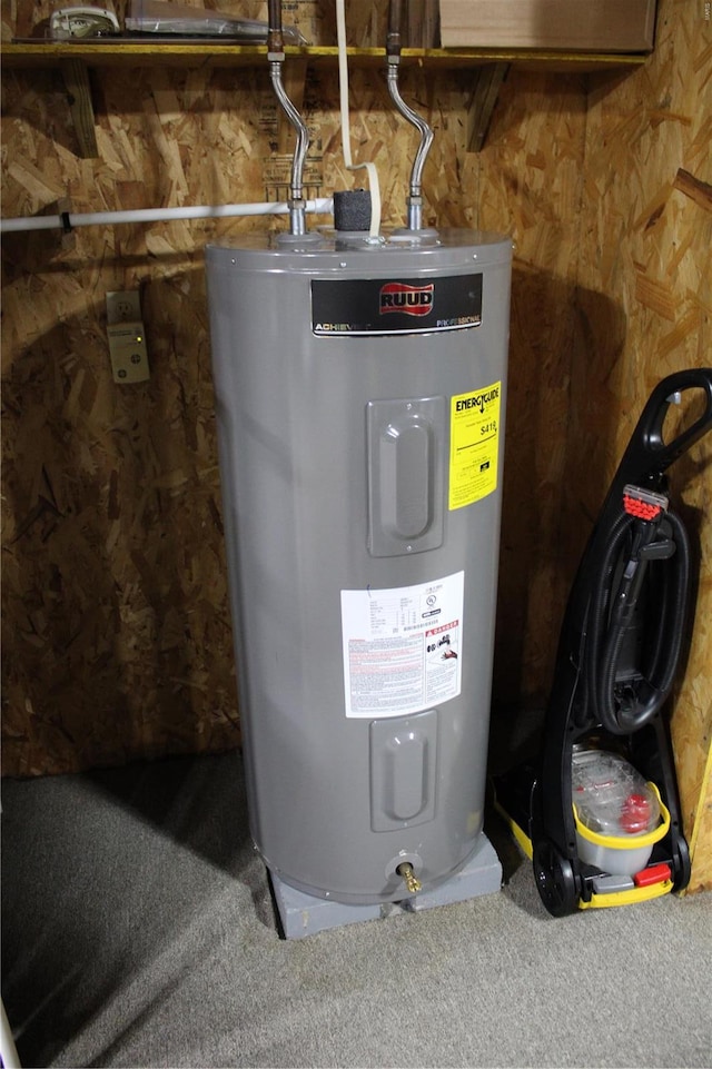 utility room featuring water heater