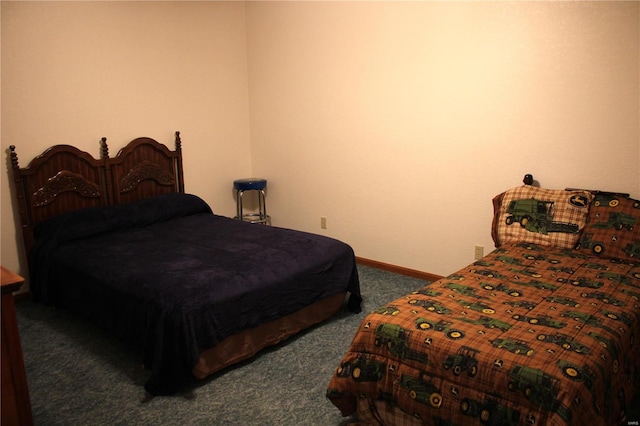 bedroom featuring carpet floors and baseboards