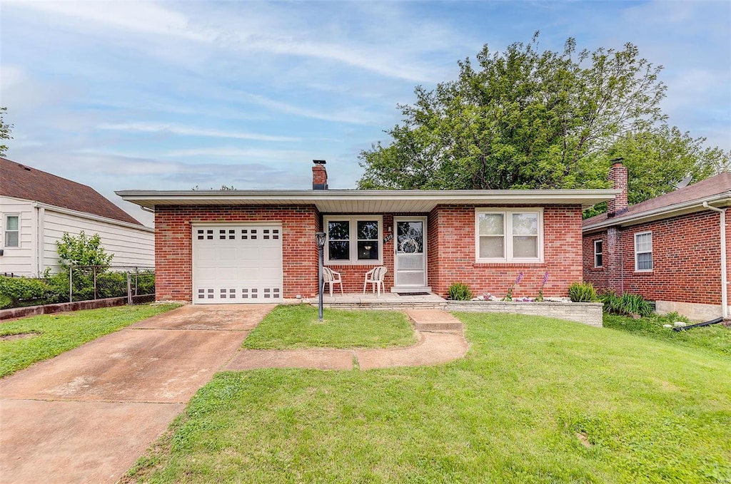 ranch-style house featuring an attached garage, brick siding, concrete driveway, a front yard, and a chimney