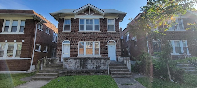 view of front of property with brick siding