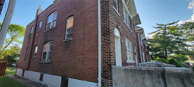 view of home's exterior with brick siding