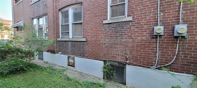 view of property exterior with brick siding