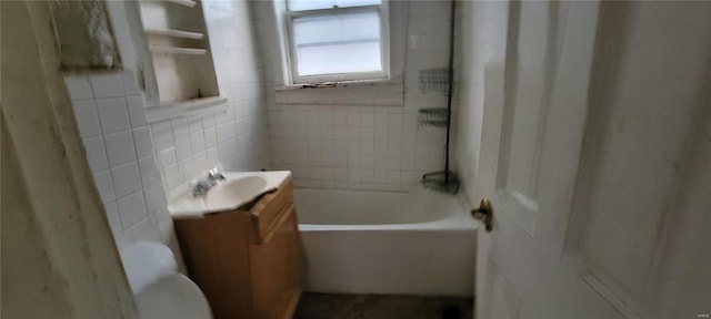 full bath featuring vanity, toilet, tile walls, and tub / shower combination