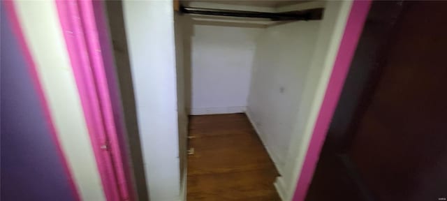 hallway featuring baseboards