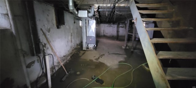 unfinished basement with heating unit