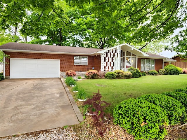 mid-century inspired home featuring an attached garage, a front yard, brick siding, and concrete driveway