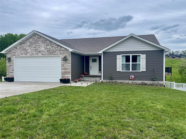 single story home with driveway, an attached garage, fence, and a front yard