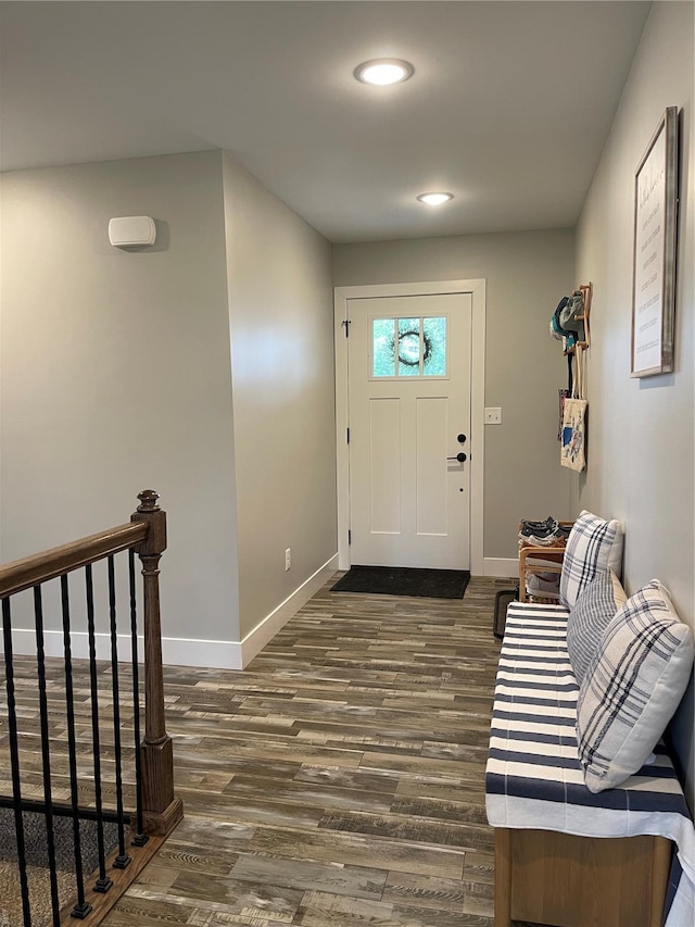 entryway featuring recessed lighting, baseboards, and dark wood finished floors