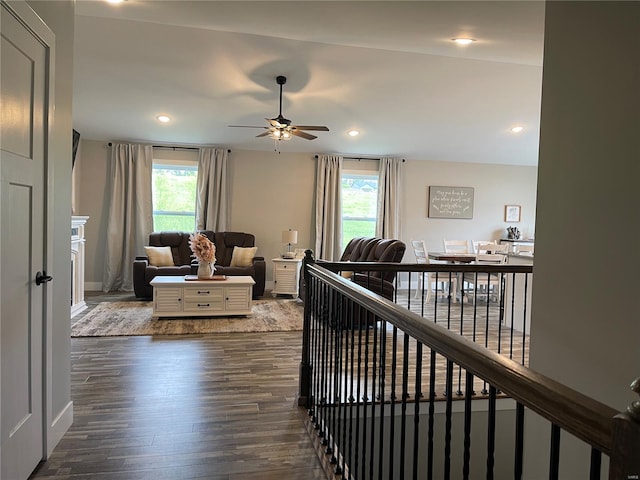 living room with ceiling fan, dark wood-type flooring, a healthy amount of sunlight, and recessed lighting