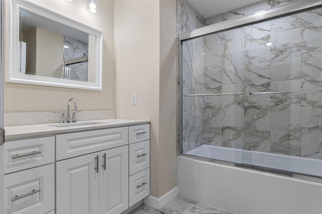 bathroom with vanity, baseboards, marble finish floor, and enclosed tub / shower combo